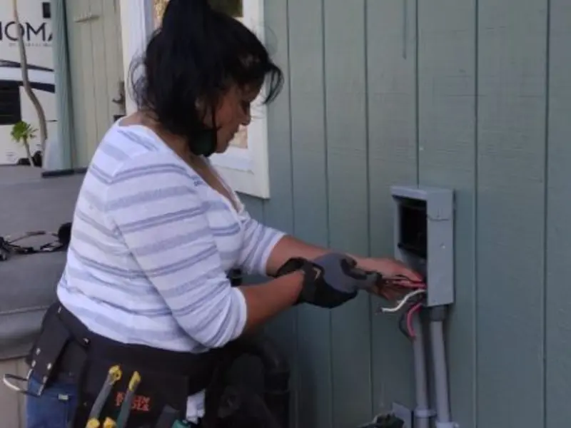 Licensed electrician wiring an exterior subpanel in Ham Lake