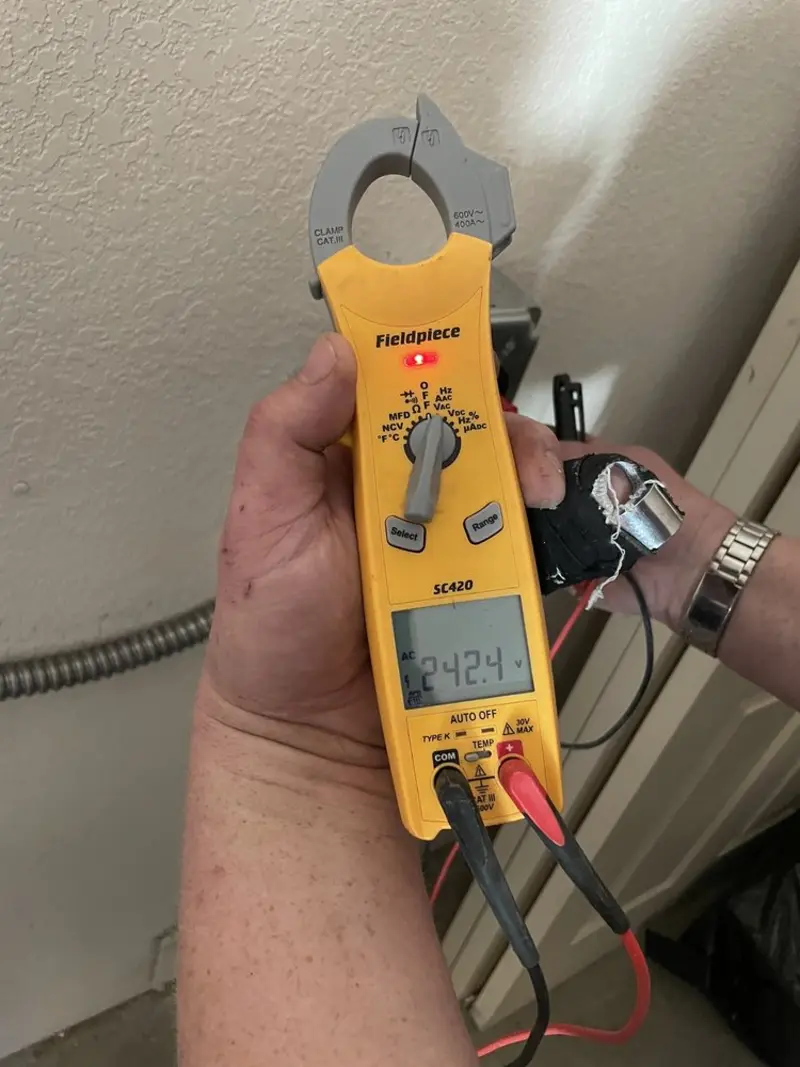 Voltage testing with clamp meter during Generator Installation in Ham Lake